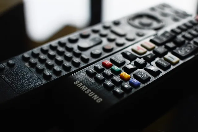 Detailed close-up of a Samsung remote control showcasing buttons and logo. How to build a connected TV advertising market outlook