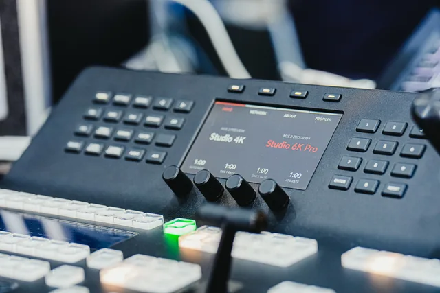Closeup of a high-tech audio video control panel featuring digital displays and control buttons. How do you build a connected TV advertising operating workflow?