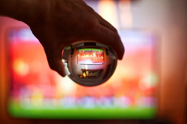 soccer, glass sphere, choreographer, hand, bengalo, fireworks, red, tv, small, screen, entertainment. Connected TV advertising UK regulations rest on statute, codes and consent